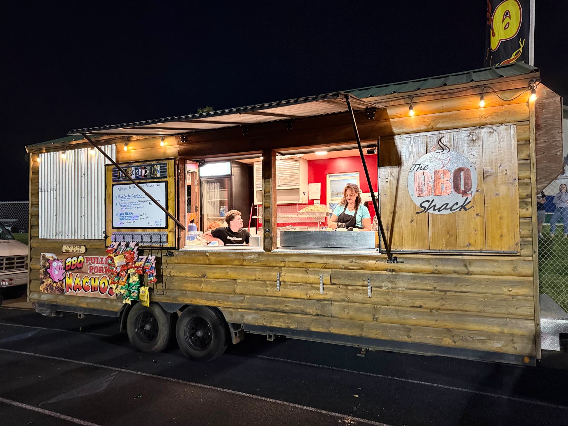 The BBQ Shack PNW food truck serving at night